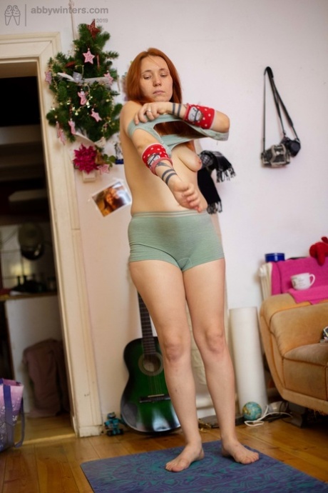 Ginger teen with small tits Simona gets spied on while dressing