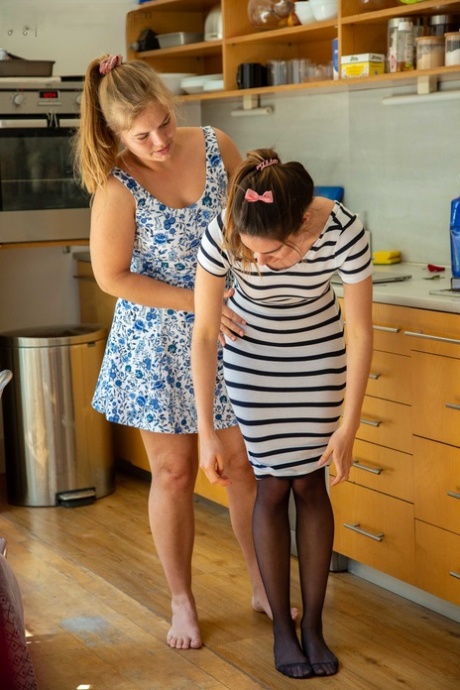 Mille and Paola G, two amateur wrestlers, dress each other up while flaunting their curves.