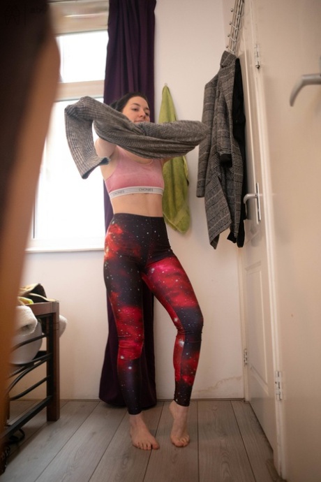 A sprightly and dashing amateur model named Marine displays her bona calves as she gets dressed.