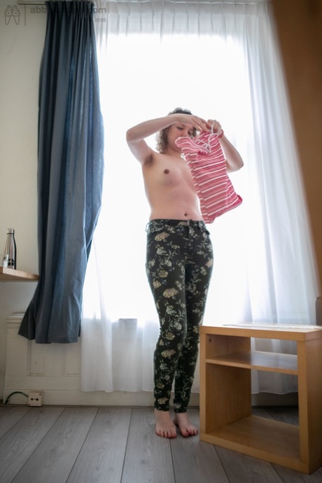 The shaven legs of Lotte L, an Australian brunette, reveal her hairy vagina and enlarged nipples.