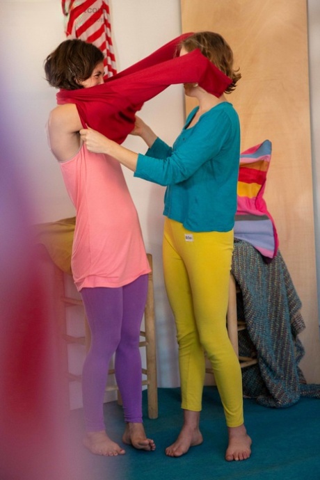 Young friends Manon and Paulina spy on while dressing each other up.
