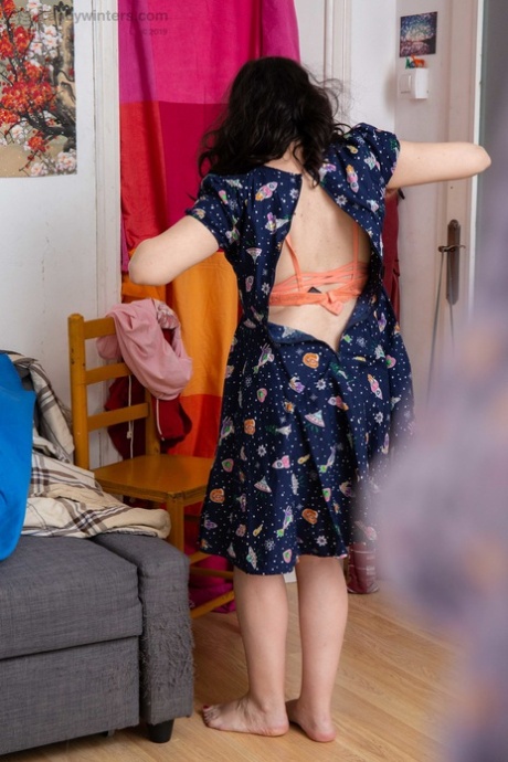 Wearing a pink panty and a summer dress, Australian geek Irene A showcases her natural curves.
