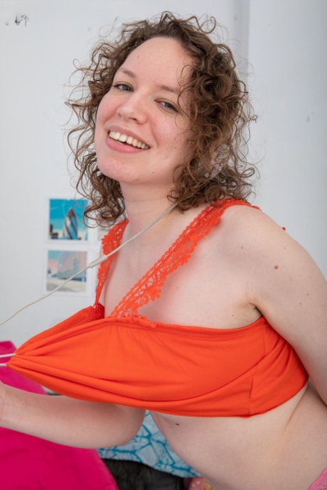 Brunette Australian Lotte L removes her pink panties & displays her furry muff