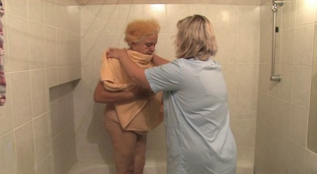 Granny Clara, the BBW host, permits her lesbian caregiver to identify her sexually aroused partner.