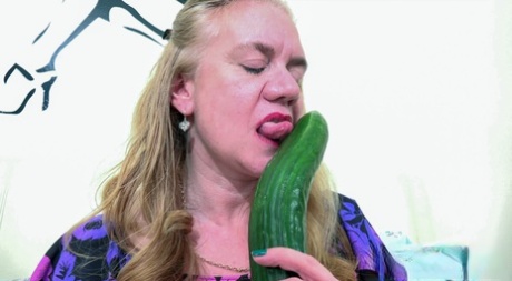 Kinky Granny Lily May Masturbates Her Horny Pussy With A Massive Cucumber