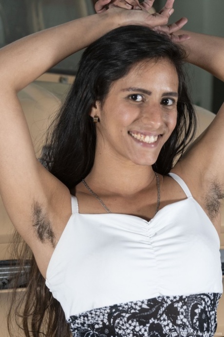 Exotic American teen Pamela stripping and flaunting her hairy pussy & armpits