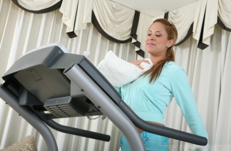 Sexy Latina MILF August demonstrates her large breasts and gets revved after working out.