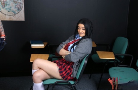 At school, an amateur girl from India Asia, who is skinny with tattoos, posing with a tattooed voyeur.