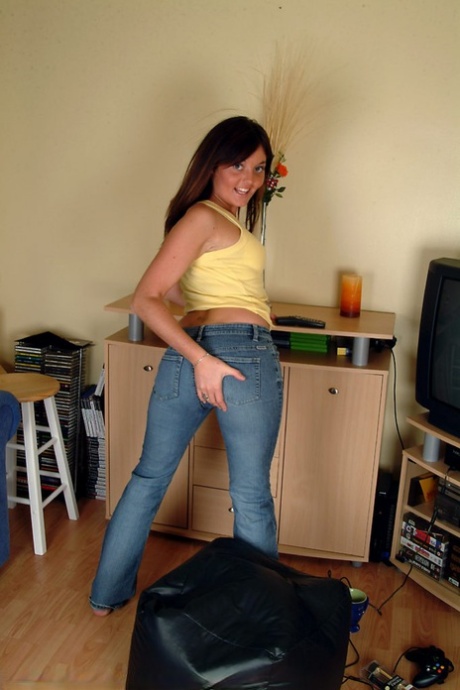 While standing, Leah, a British amateur, removes herself and toys with her horny companion.