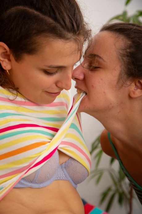 Lucia M and Pascal, who are romantically involved with someone from Australia, are seen brushing each other's pussies.