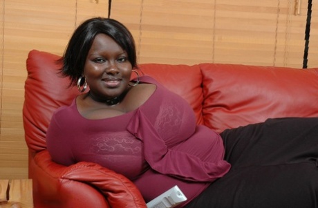 Her huge breasts are revealed as Afro-American BBW Mariana Kodjo goes topless.