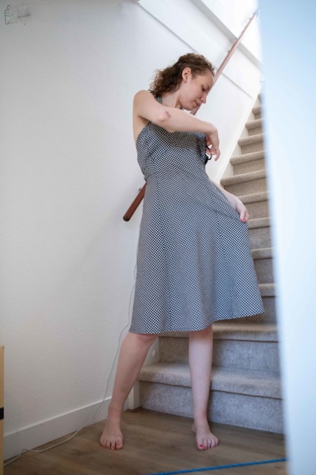 Pretending to her prom outfit is a young girl Lotte L with tiny fisties, wearing an outfit before she sews up.