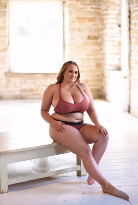 Oversized bra: Fat model Sara Willis lets out her monster boobs as she poses topless.