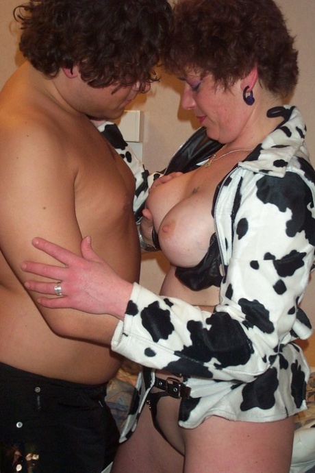Saskia (the brunette grandmother) shows off her big tits, gives fellatio, and gets hit with hard objects like cannon points.