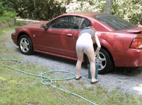 Amateur teen Nicki Blue unveils her tiny tits & hot muff while washing the car