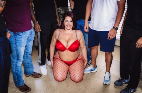 Jessica Jax, the wife of a man who is not very tall, wears red lingerie and displays her cum-filled face.