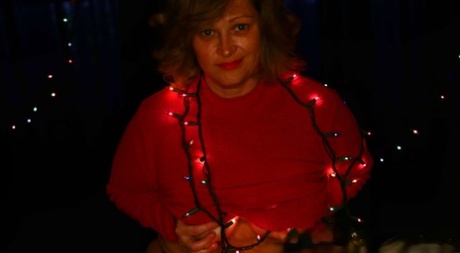 Cute Chubby Amateur MILF Poses In Her Sexy Outfit Under Xmas Lights
