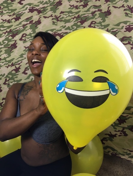 Amateur Ebony Kassey Starr Teases With Her Cleavage And Poses With A Balloon
