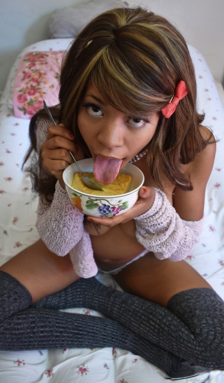 Black Babe In Gray Socks Little Yumi Flaunts Her Tits While Eating On A Bed
