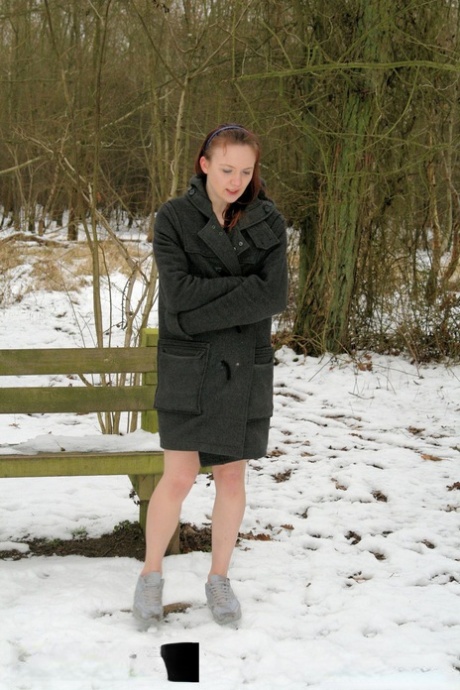 MILF, the seductive amateur, was captured in her coat and running shoes while out in the snow.