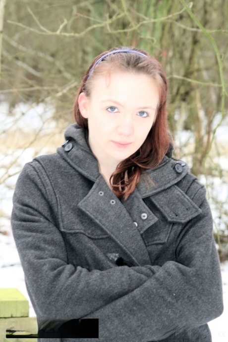 MILF, a seductive amateur, was captured in her coat and running shoes while out in the snow.