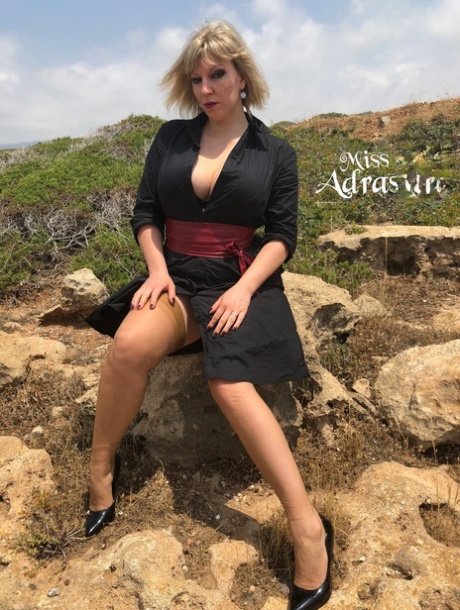 Seductive MILF Miss Adrastea Flaunts Her Sexy Legs In Her Stockings Outside