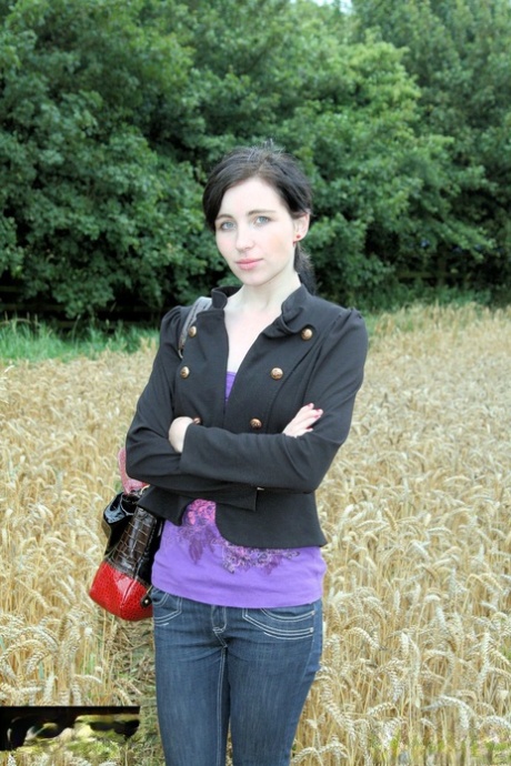 Gorgeous Brunette Babe Posing In Her Purple Shirt & Jeans In A Wheat Field