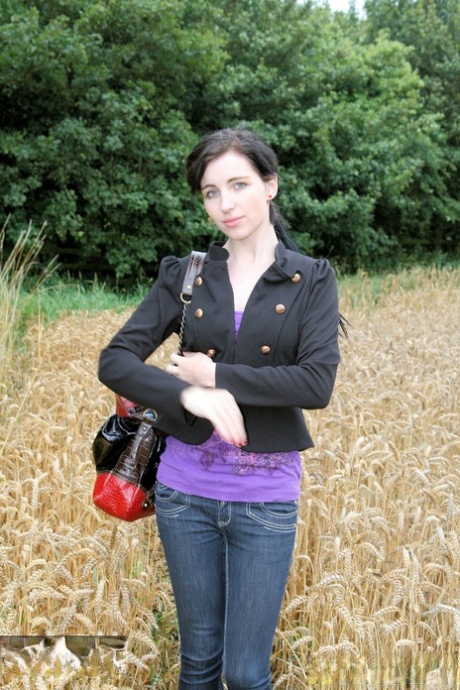 Gorgeous Brunette Babe Posing In Her Purple Shirt & Jeans In A Wheat Field