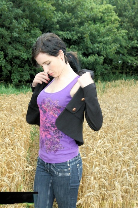 Gorgeous Brunette Babe Posing In Her Purple Shirt & Jeans In A Wheat Field