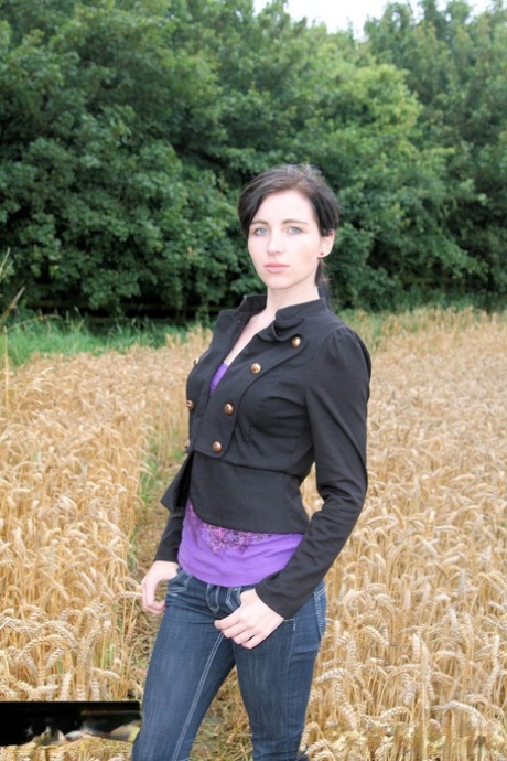 Gorgeous Brunette Babe Posing In Her Purple Shirt & Jeans In A Wheat Field