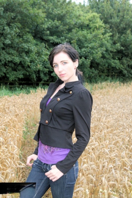 Gorgeous Brunette Babe Posing In Her Purple Shirt & Jeans In A Wheat Field