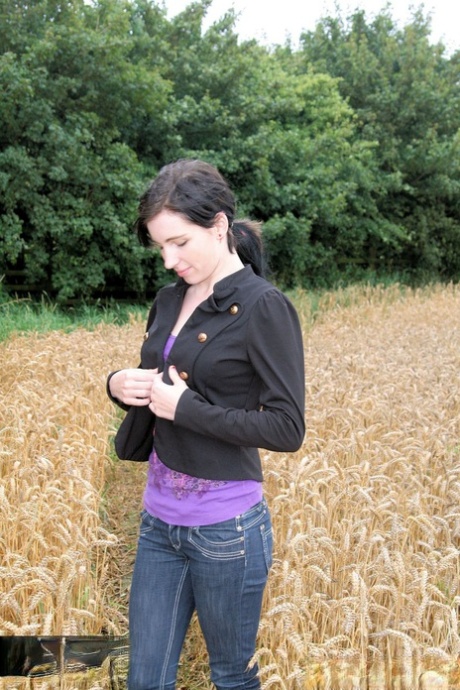 Gorgeous Brunette Babe Posing In Her Purple Shirt & Jeans In A Wheat Field