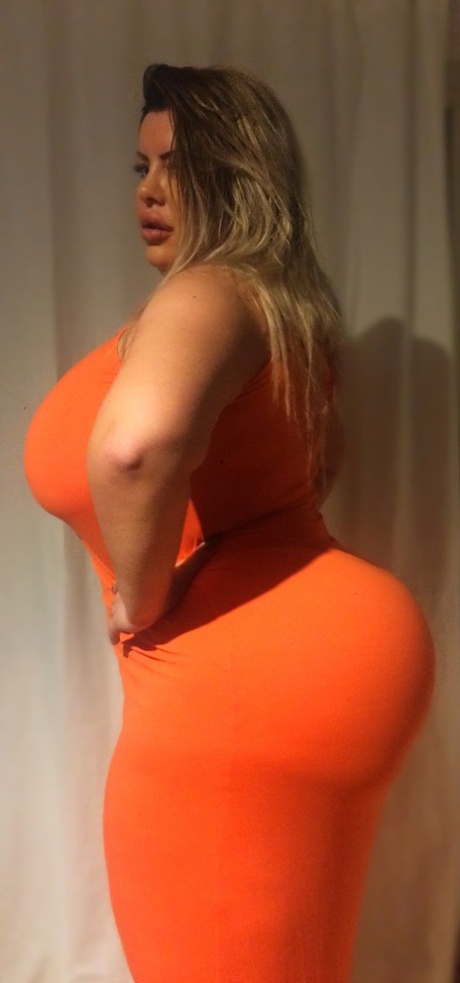 Black woman Natasha Crown exposes her fatty anal area in her tight dress.