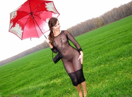 Brunette MILF Jeny Smith Posing In A Black Sheer Dress In Public