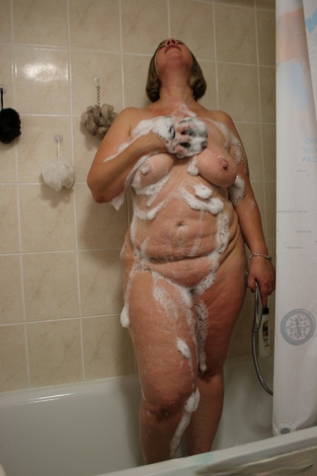 Her chubby nude body is shown by the Blonde MILF Shooting Star in the shower.