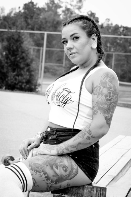Outside, Miss Pink is seen sporting her sexy attire as a chubby skater.