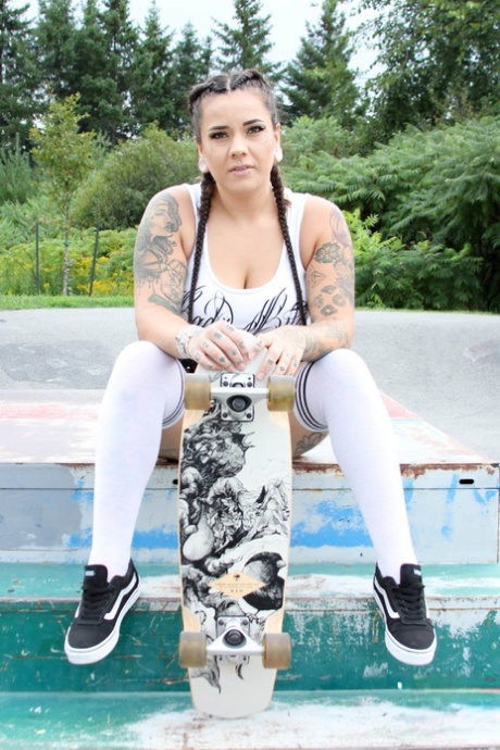 Posing in her sexy costume outdoors, Miss Pink is the embodiment of an urban skater.