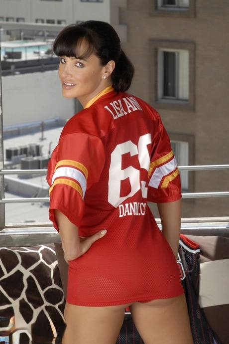 Dirty MILF in a jersey Lisa Ann toys her cunt after showing her grand boobs