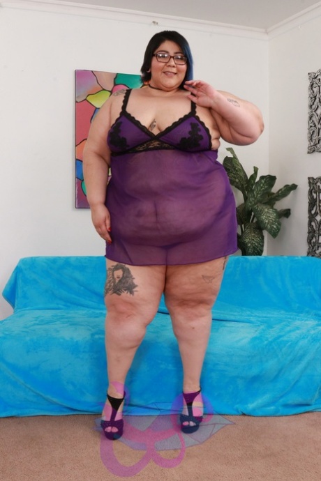Fat broad in glasses Crystal Blue strips and flaunts her curvy body