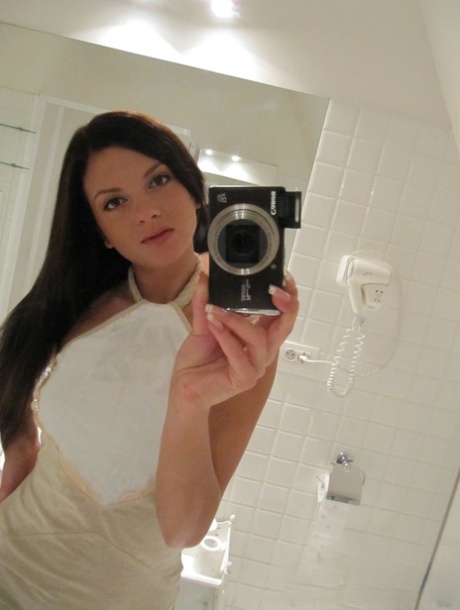 Sexy babe sewn as she takes selfies with her big tits in the bathroom.