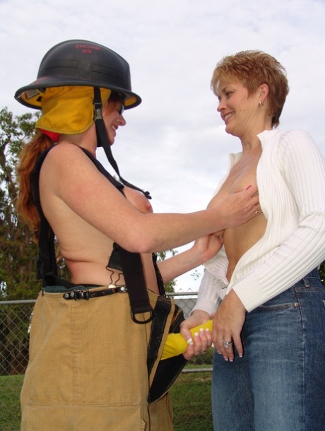 Busty Lesbian Firefighter Dee Fucks A Short-haired Lady In Public