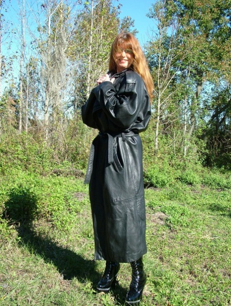 Horny MILF Shows Off Her Huge Juggs And Poses In Black Leather Boots Outdoors