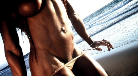 The beach is where Alexis Ellis, a bodybuilder from Canada, flaunts her six-pack and newly developed nipples.