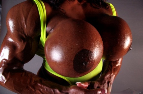 Ebony Bodybuilder Yvette Bova Gets Her Huge Fake Tits Out While Working Out