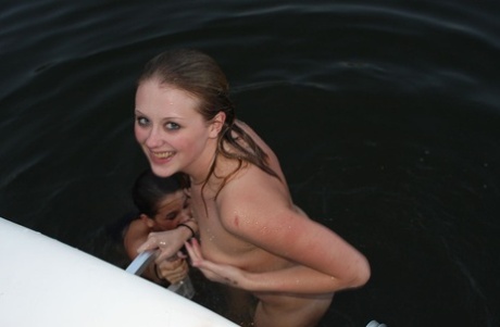 Two smoking hot lesbian teens in sexy bikinis scissoring on a boat