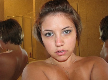 Sexy teen amateur shows off her big breasts while taking nude photos