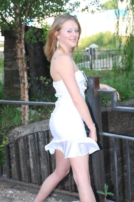 Slutty amateur teen lifts her dress up and flashes her panties in public