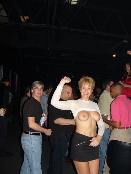 The nightclub's mature partners engage in sexual activities where they strip and lick each other's pussies.