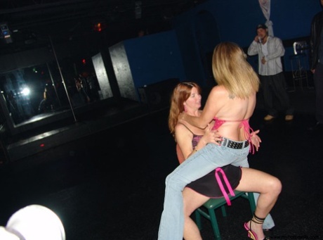 Aged females at the nightclub club sear and lick each other's pusses and tits in front of their partners.