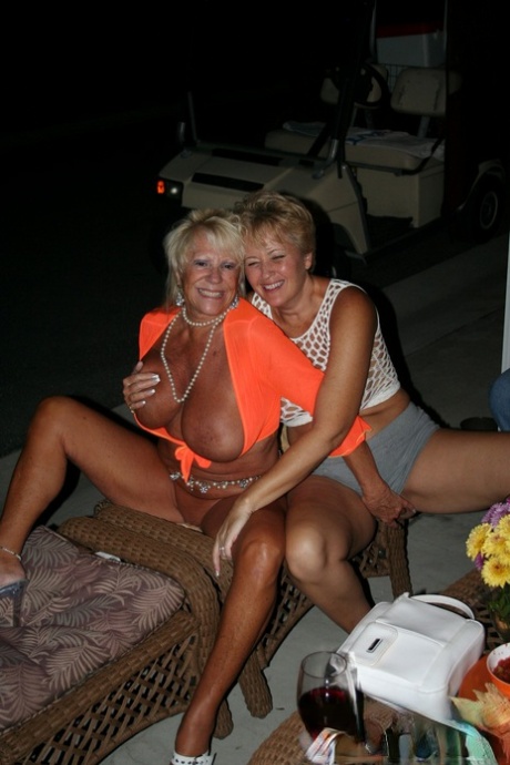 Amateur swinger Kay and her friends display their large tits with tasty oysters.